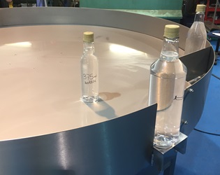 Rotary table with glass bottles