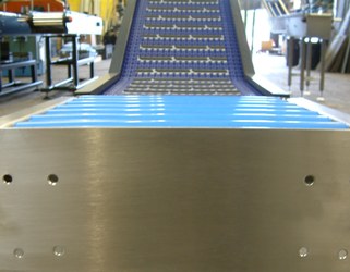 Gravity Roller Conveyor feeding a modular belt elevator